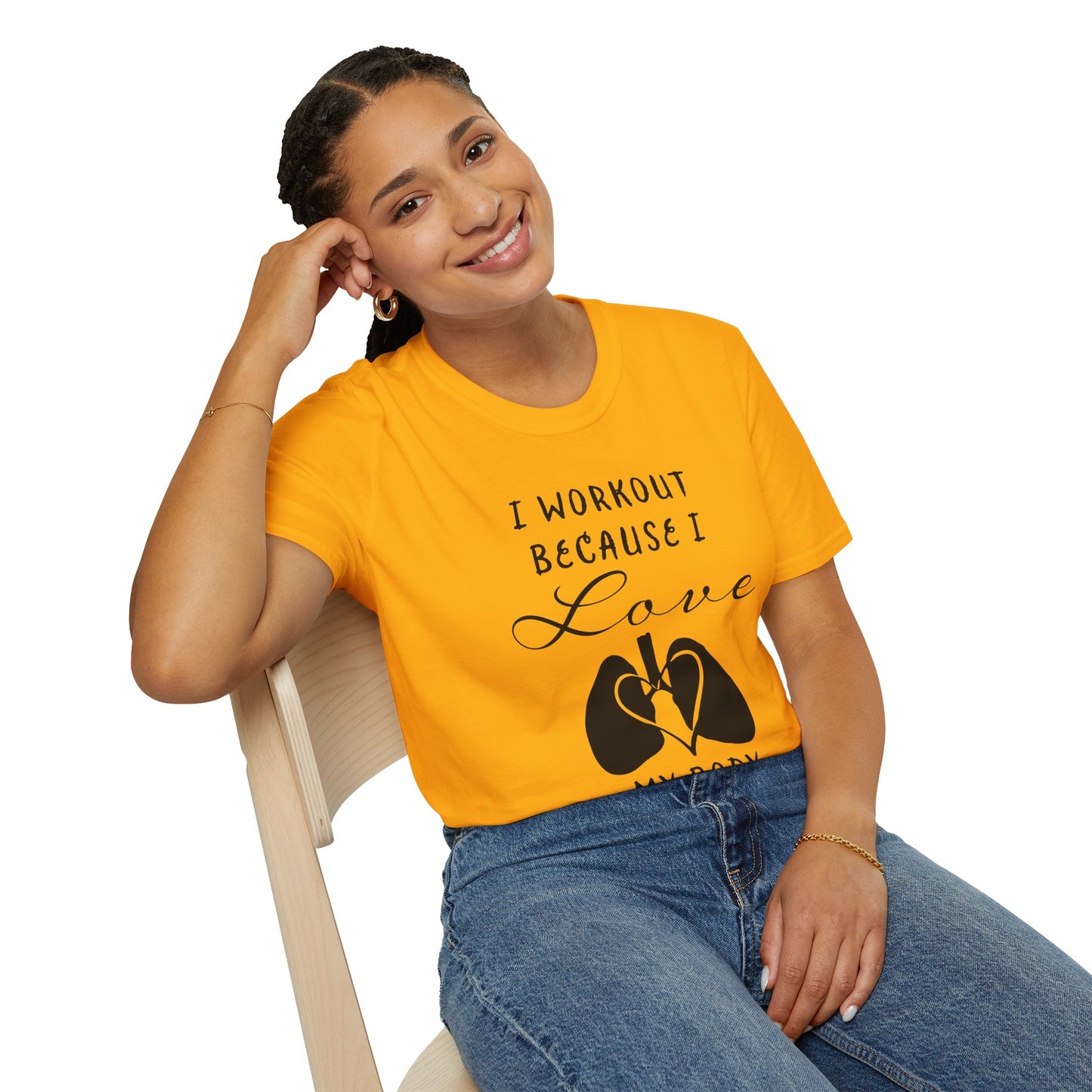 Woman wearing a yellow unisex short sleeve t-shirt with a bold message: "I workout because I love my body," paired with a simple drawing of a heart and lungs—because cardio is more than a vibe, it’s biology.