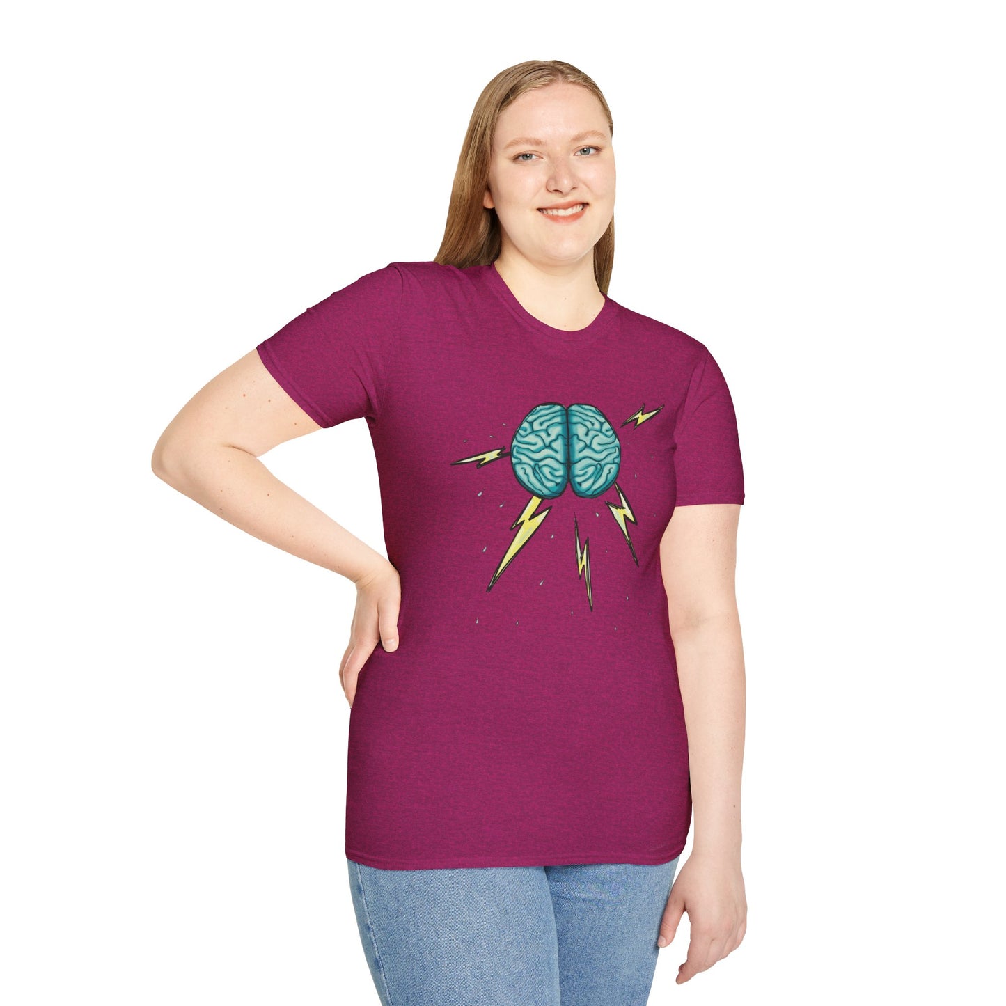 Woman wearing a pink unisex short sleeve tee featuring an illustration of a brain with lightning bolts and rain pouring from it, giving a literal twist to the term "brainstorm"—because sometimes, even the best ideas need a little weathering!
