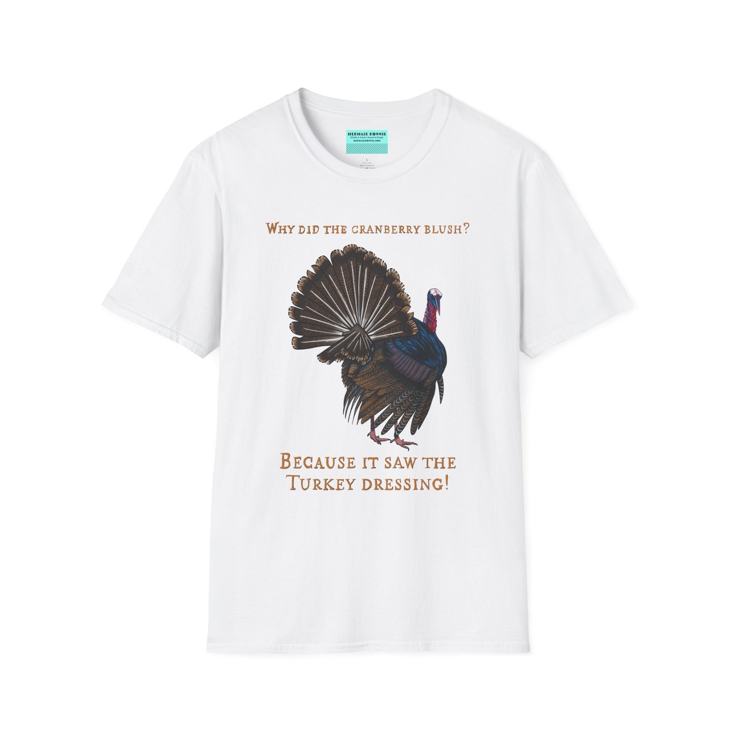 White Thanksgiving t-shirt featuring a picture of a turkey and the text 'Why did the cranberry blush? Because it saw the turkey dressing!
