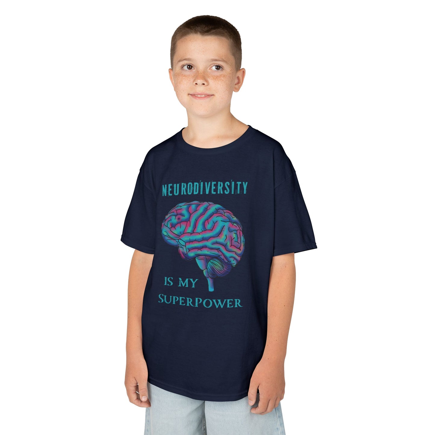 Boy is wearing a navy unisex kids' t-shirt featuring a drawing of an anatomical brain and the text 'Neurodiversity is my superpower.'