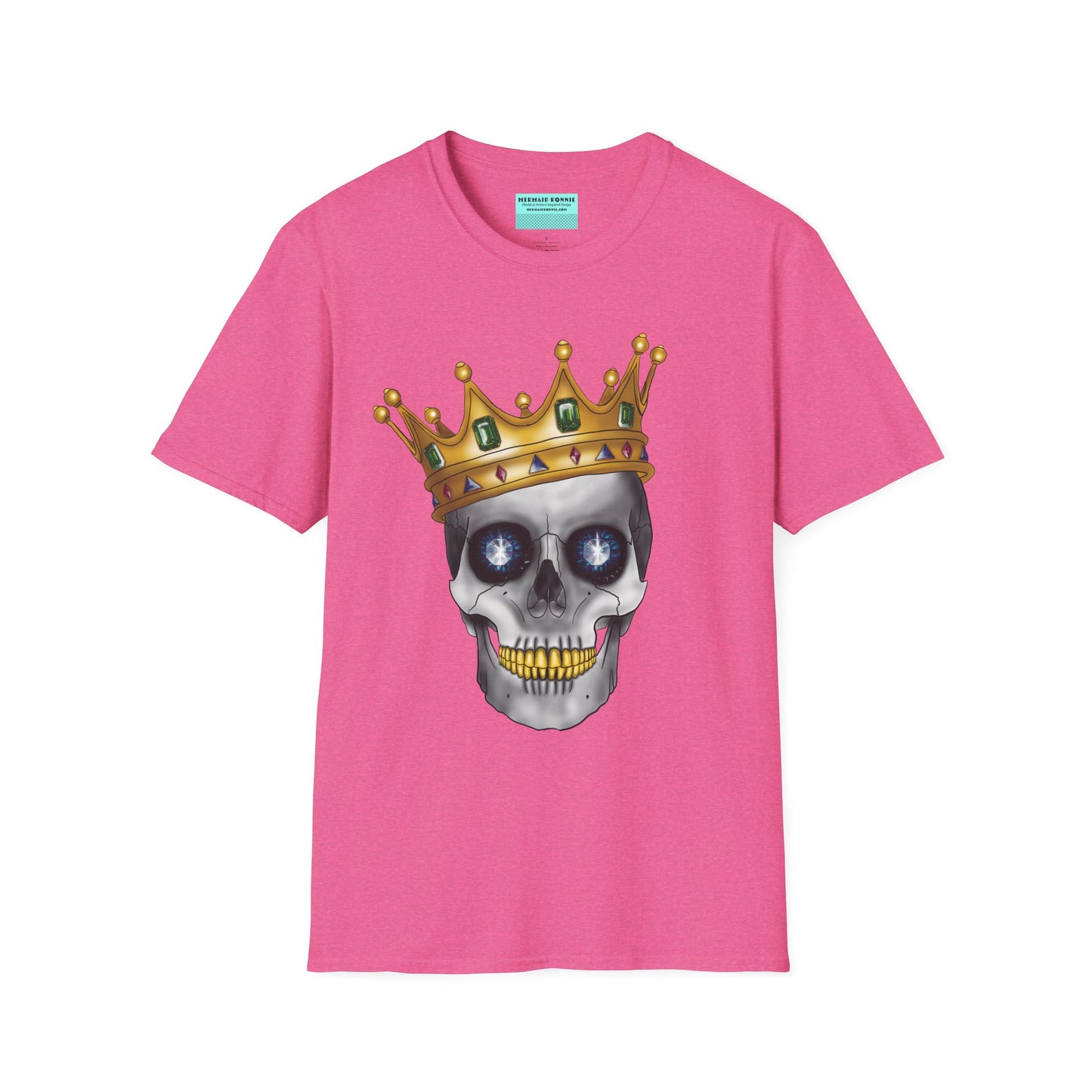 Pink t-shirt featuring an anatomical skull wearing an ornate crown, with gold teeth, large sapphire gemstones in the eye sockets, and emeralds and rubies decorating the crown.