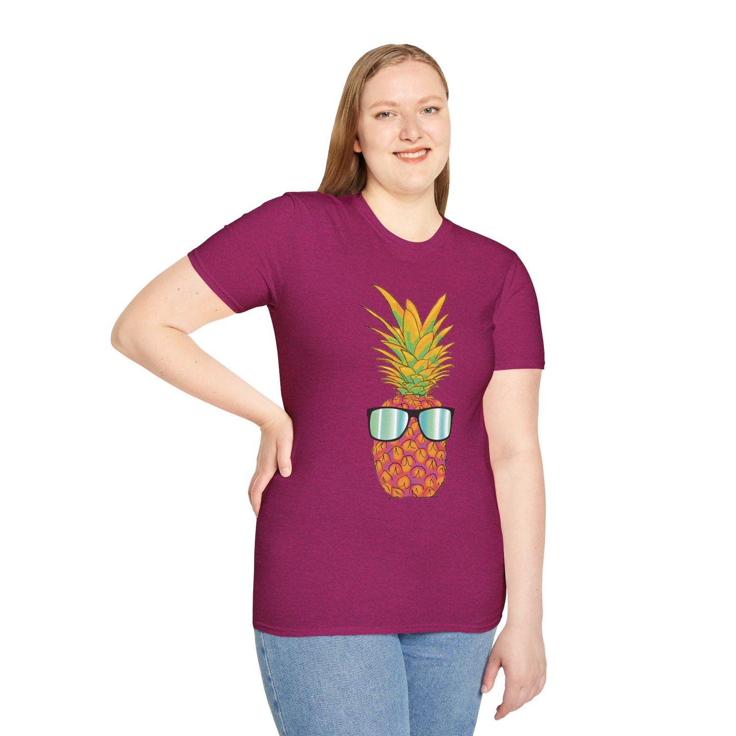 Woman wearing a fuscia t-shirt featuring a drawing of a pineapple wearing sunglasses.