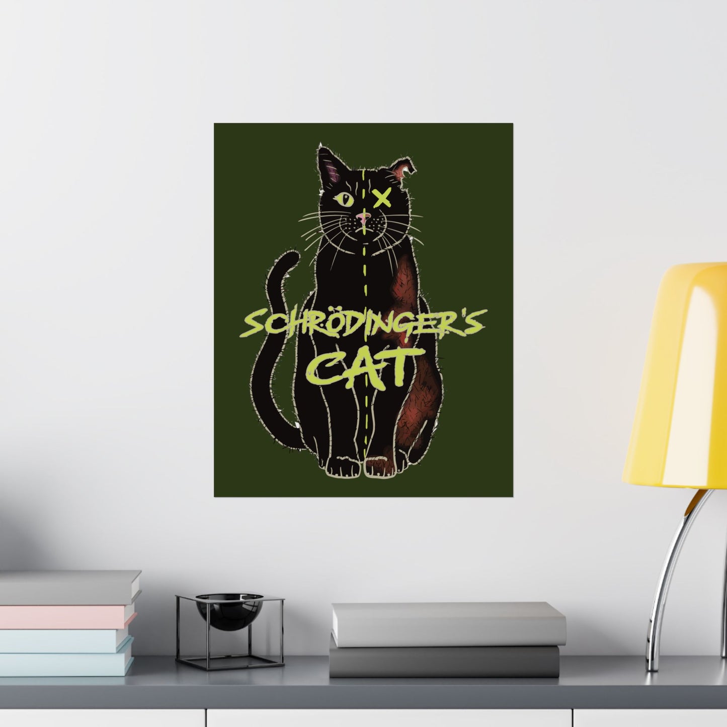 A large thought-provoking Schrödinger's Cat poster set against a dark green background, featuring a black cat split down the middle—half alive, half dead. The phrase “Schrödinger's Cat” sits boldly across the image, capturing the paradox of quantum physics with a dash of feline mystery. It is shown here hung in an office setting.