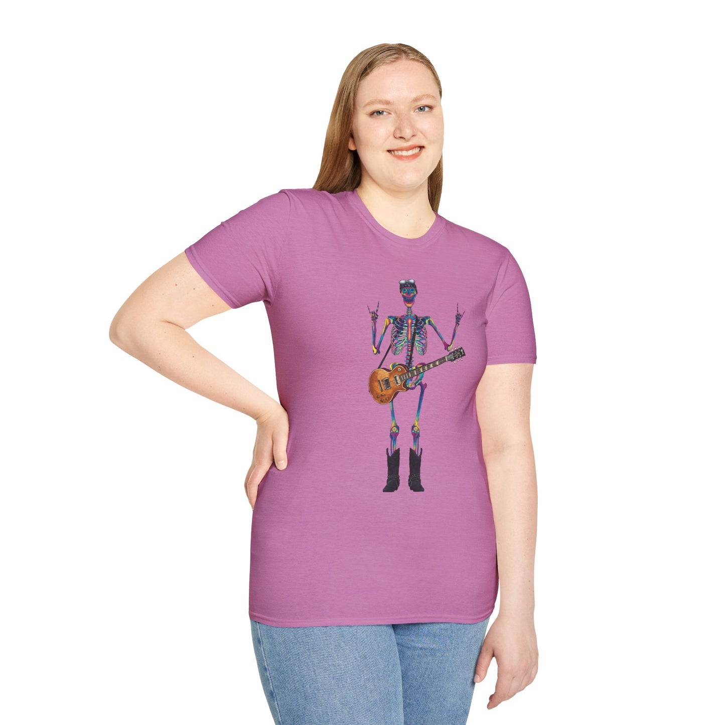 Woman wearing a pink t-shirt featuring a tie-dye skeleton holding a guitar, dressed like a classic rocker with boots, a bandana, and rock-style clothing.