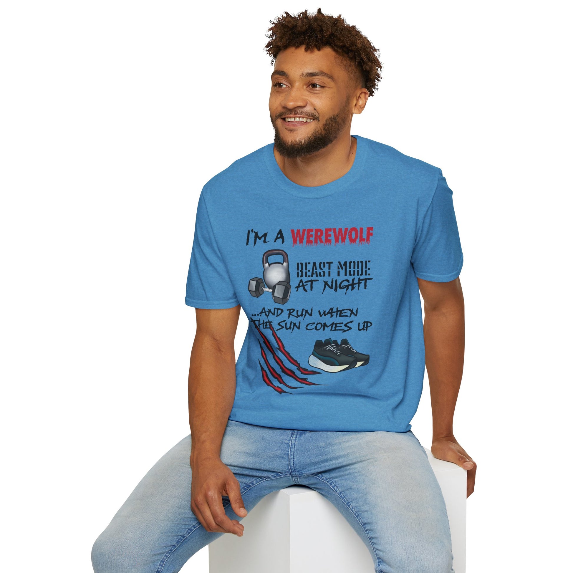 Man wearing a light blue t-shirt featuring illustrations of kettlebells, dumbbells, and running shoes, with the phrase 'I'm a werewolf. Beast mode at night, and run when the sun comes up.'