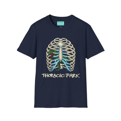 Navy unisex short sleeve tee with a clever Jurassic twist—an anatomical rib cage doubles as a prehistoric prison for a tiny T-Rex, with the punny caption "Thoracic Park" below. It's dino-mite meets anatomy class in the best way possible.
