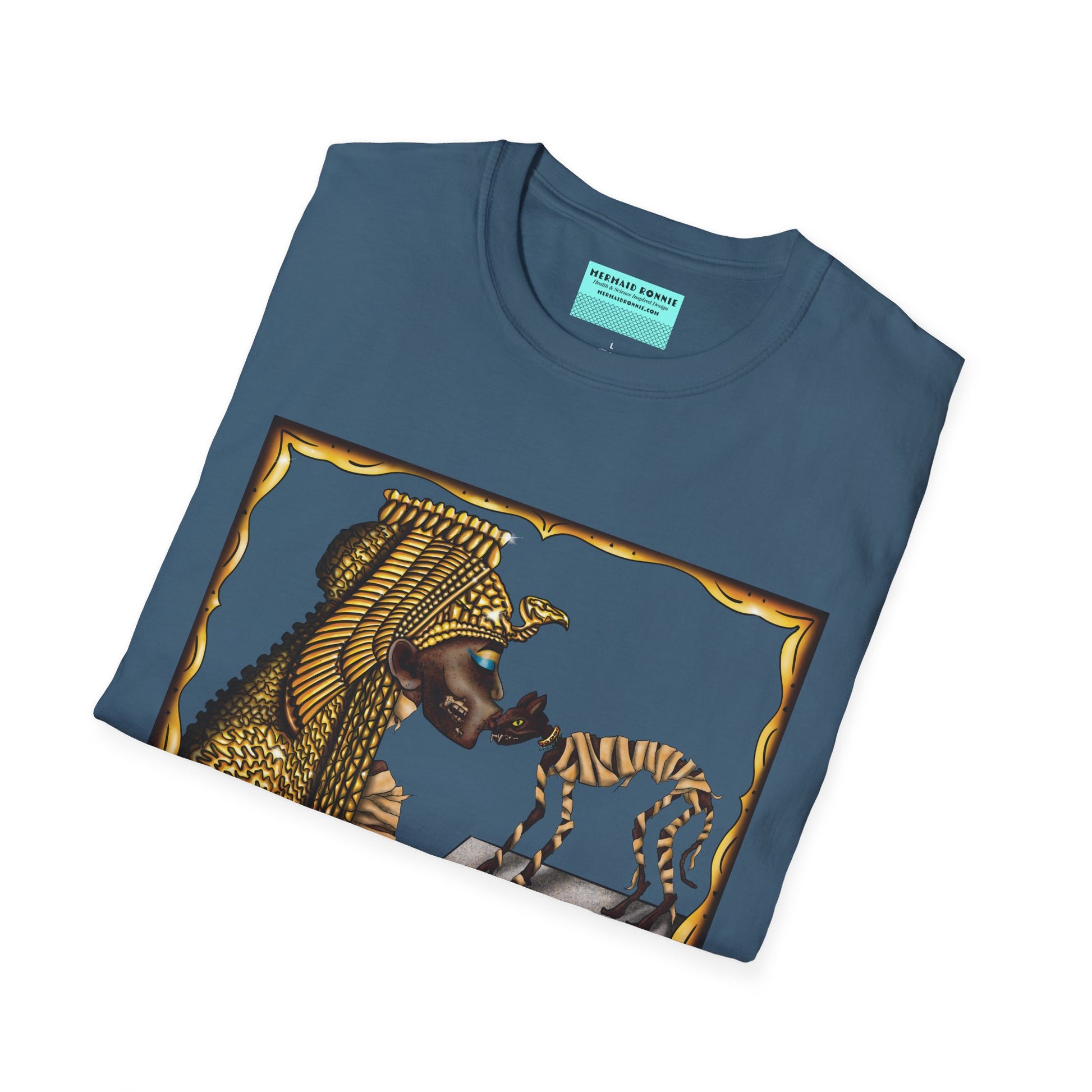 Folded blue t-shirt featuring an illustration of Cleopatra mummy kissing a cat mummy.