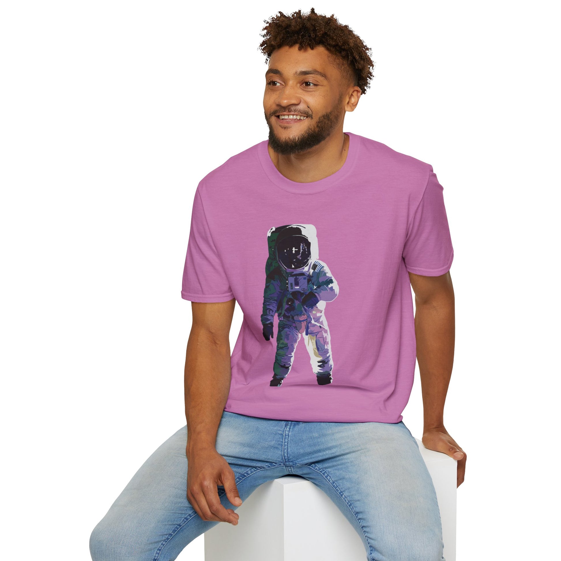 Man wearing a light purple t-shirt featuring a drawing of an astronaut in a space suit.