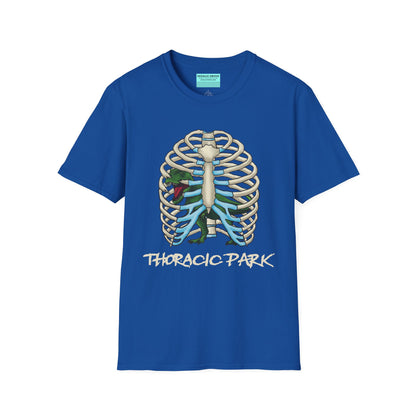 Royal blue unisex short sleeve tee with a clever Jurassic twist—an anatomical rib cage doubles as a prehistoric prison for a tiny T-Rex, with the punny caption "Thoracic Park" below. It's dino-mite meets anatomy class in the best way possible.