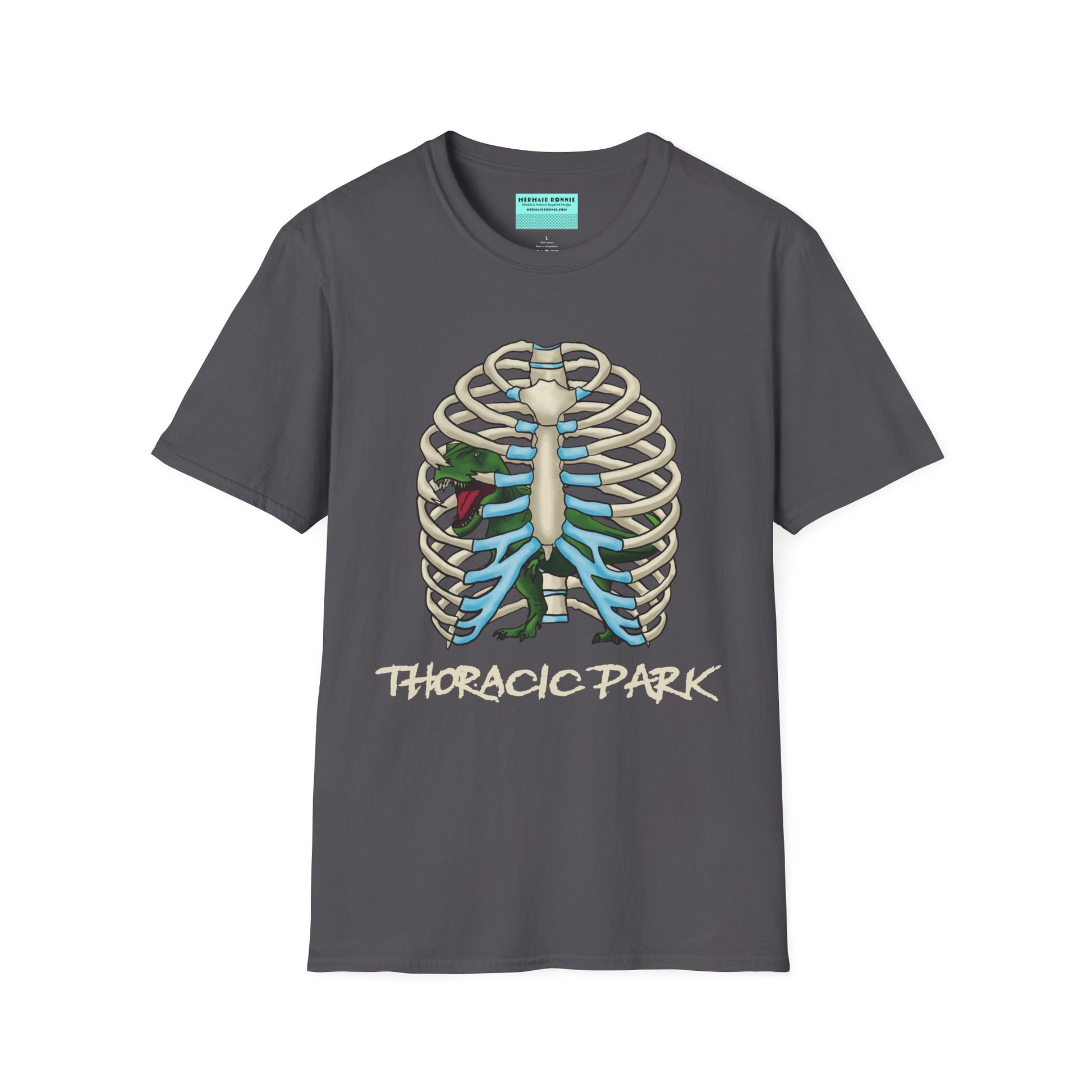 Charcoal grey unisex short sleeve tee with a clever Jurassic twist—an anatomical rib cage doubles as a prehistoric prison for a tiny T-Rex, with the punny caption "Thoracic Park" below. It's dino-mite meets anatomy class in the best way possible.