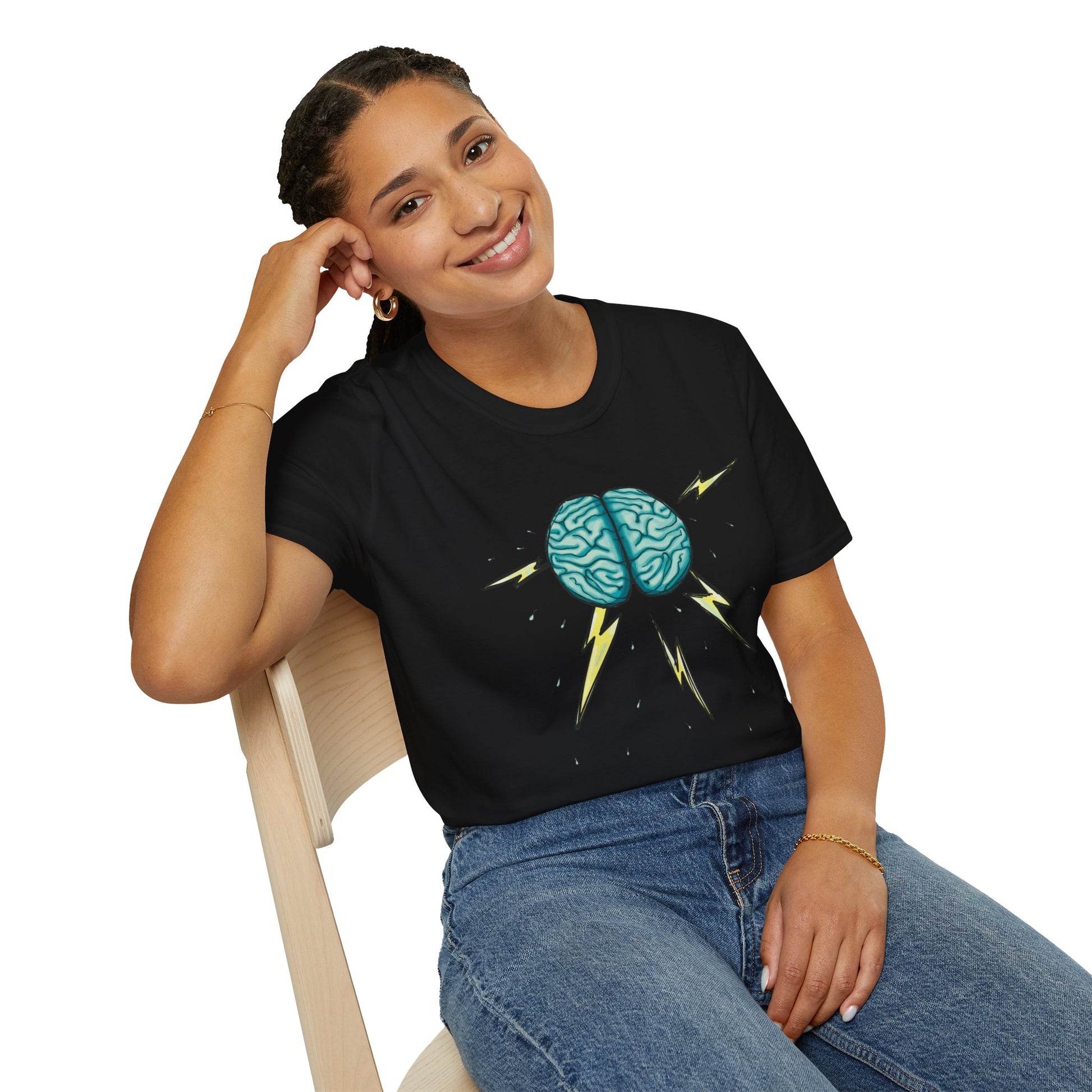 Woman wearing a black unisex short sleeve tee featuring an illustration of a brain with lightning bolts and rain pouring from it, giving a literal twist to the term "brainstorm"—because sometimes, even the best ideas need a little weathering!