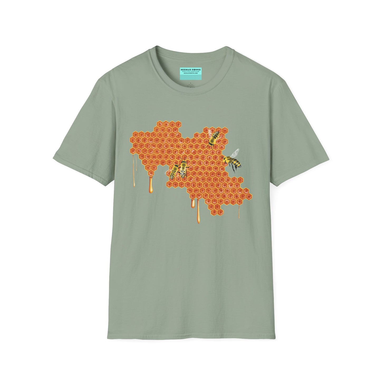Sage green t-shirt featuring a picture of honeybees buzzing around a large piece of honeycomb with honey dripping down from it.