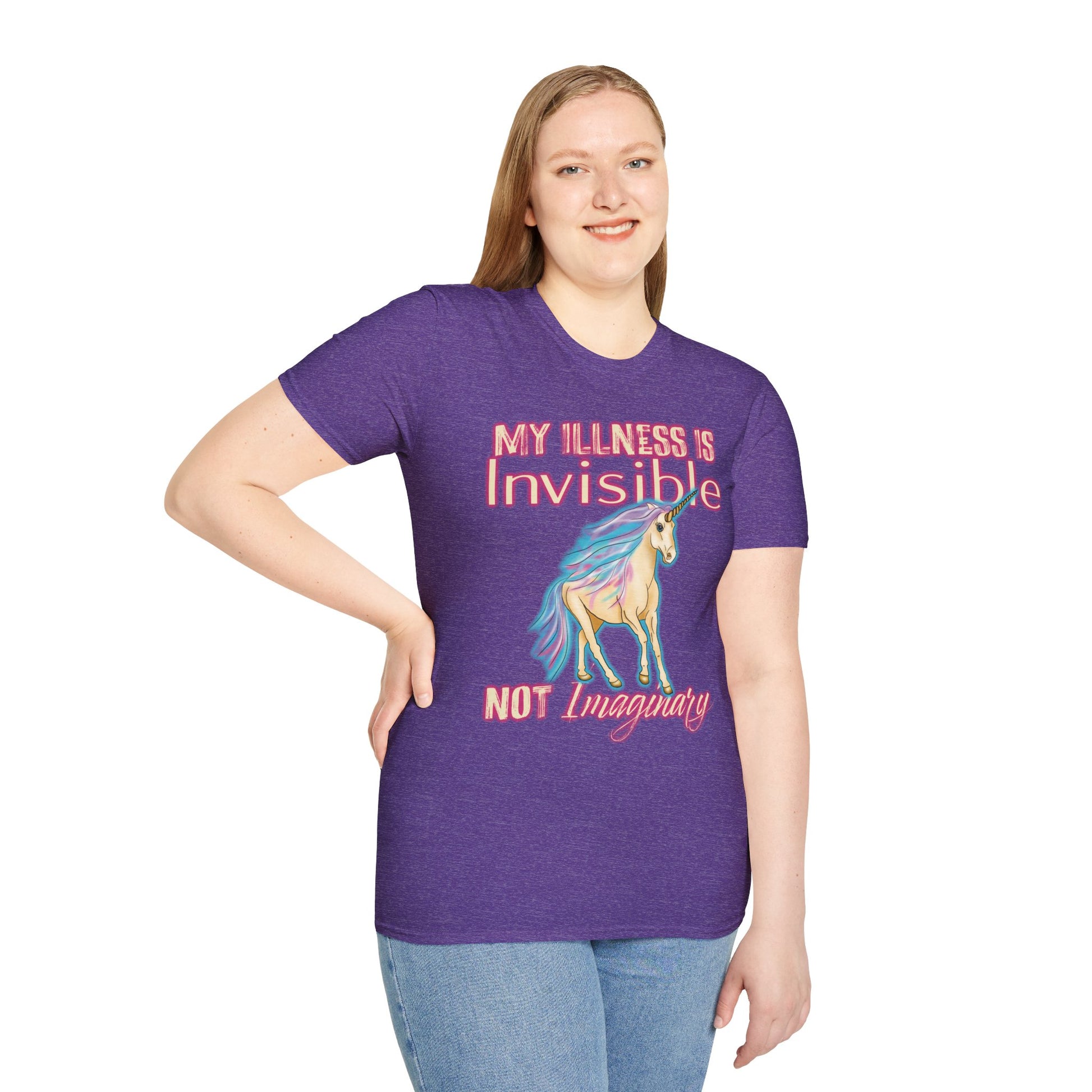Woman wearing a purple shirt featuring a drawing of a unicorn and the phrase 'My illness is invisible not imaginary'.