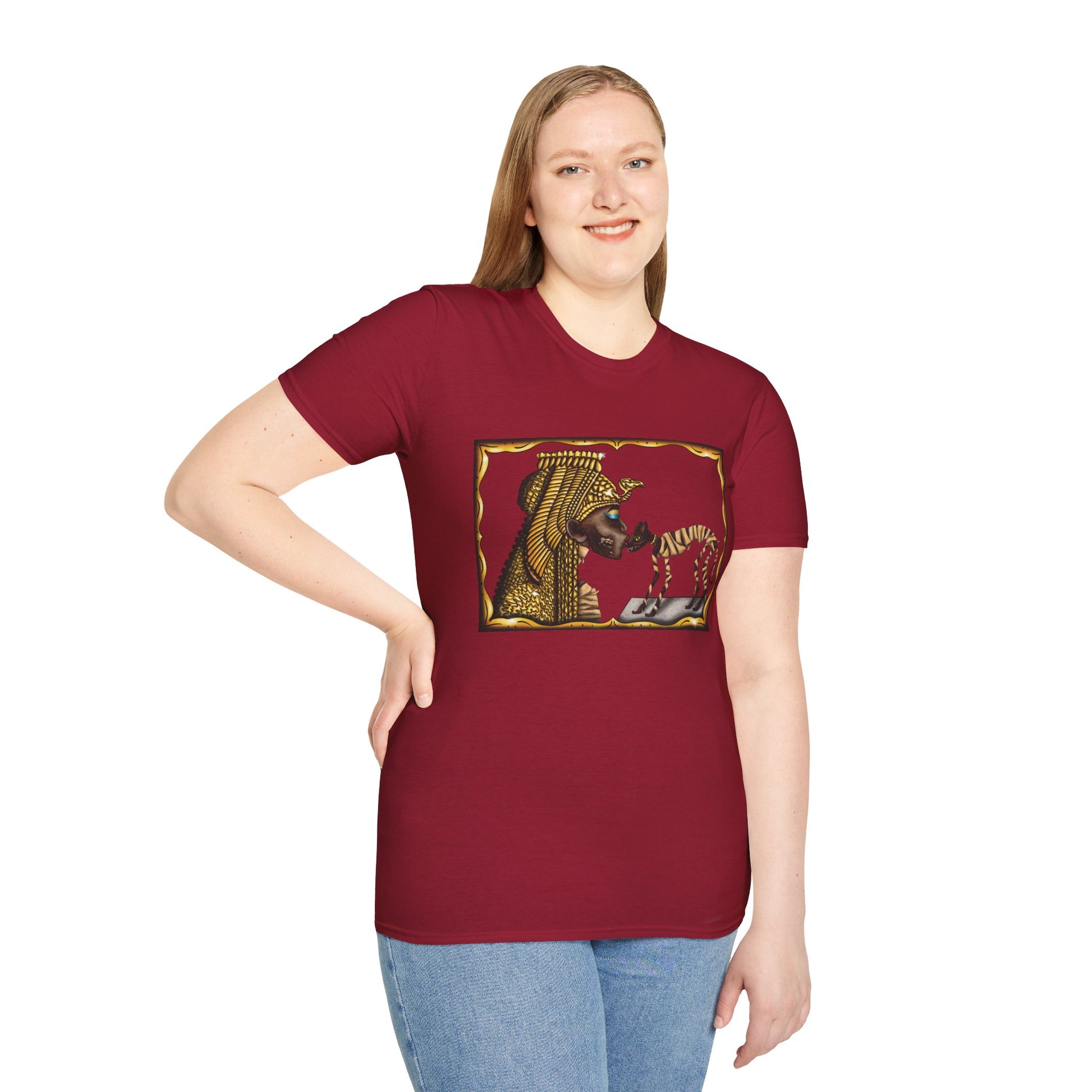 Woman wearing a red t-shirt featuring an illustration of Cleopatra mummy kissing a cat mummy.
