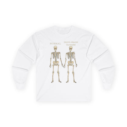 A white long sleeve shirt with two skeletons side by side—one labeled "normal," the other "Ehlers-Danlos Syndrome"—visually showcasing the effects of EDS with a clever, anatomy-inspired twist.