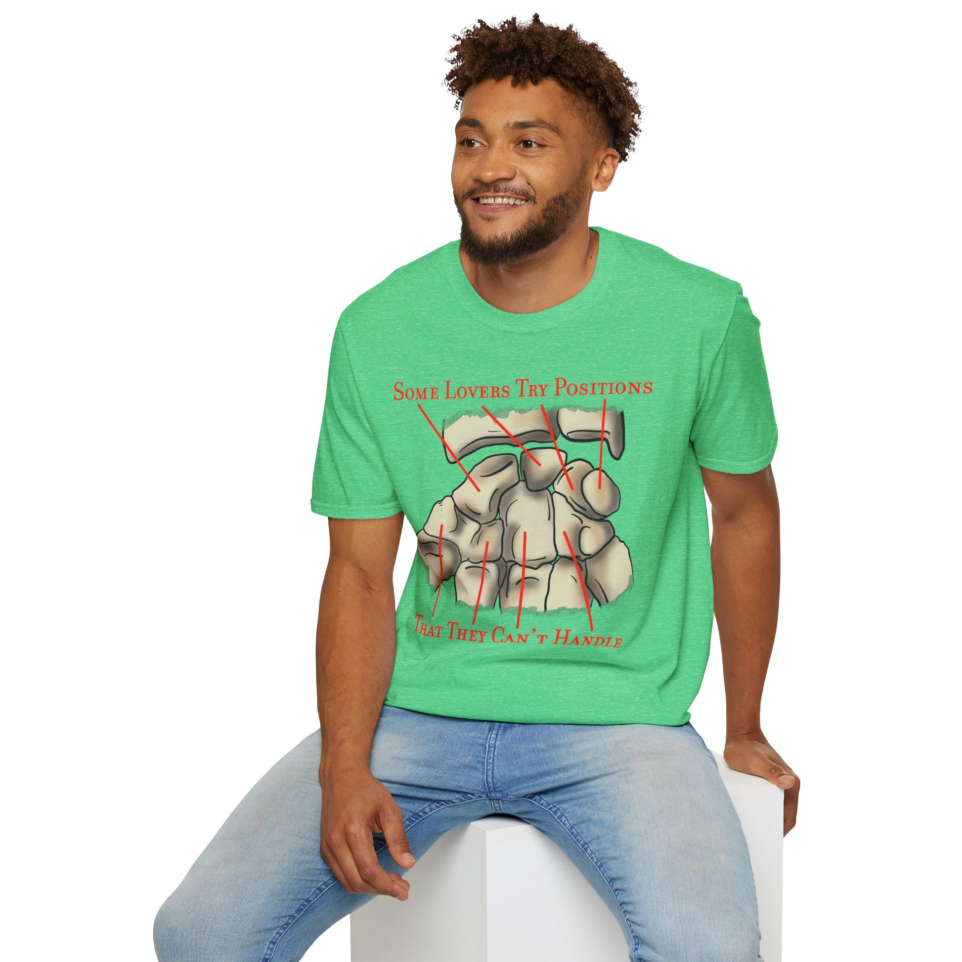 Man wearing a green t-shirt featuring an anatomical drawing of the carpal bones, with the mnemonic 'Some lovers try positions that they can't handle' displayed.