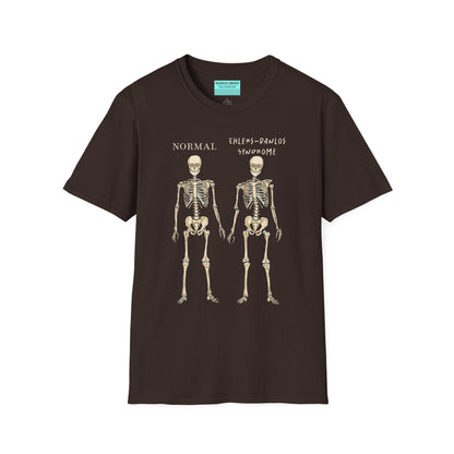 Brown unisex short sleeve t-shirt featuring two skeletons side by side—one labeled "normal," the other "Ehlers-Danlos Syndrome"—because connective tissue disorders deserve more visibility (and maybe a sense of humor, too).