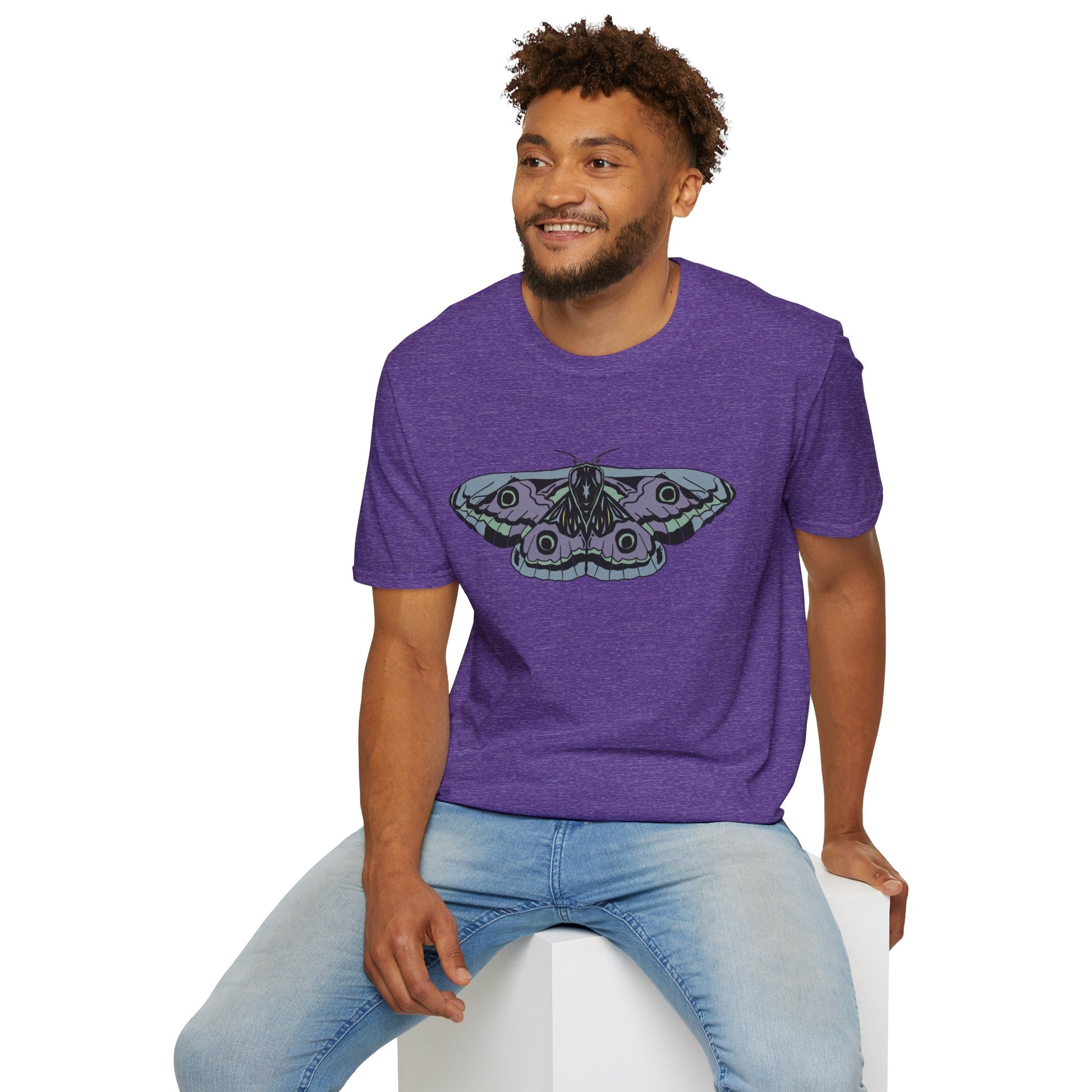 Man wearing a purple t-shirt featuring a drawing of a blue and purple moth.