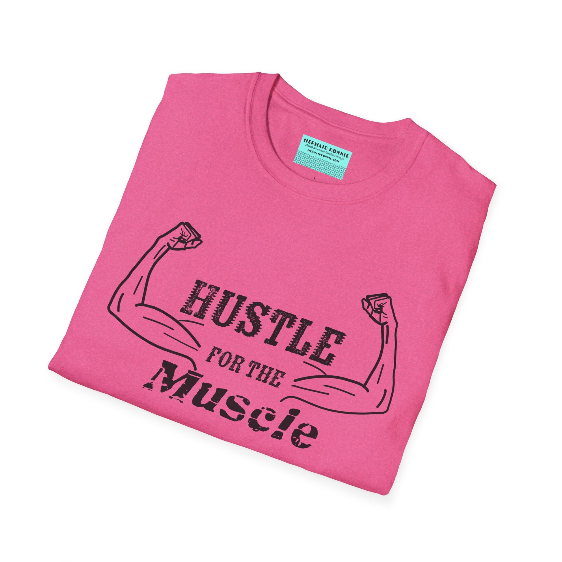 Folded pink unisex short sleeve t-shirt with a bold graphic of strong, flexed feminine arms and the empowering phrase "Hustle for the Muscle"—because strength is stylish and lifting is for everyone.