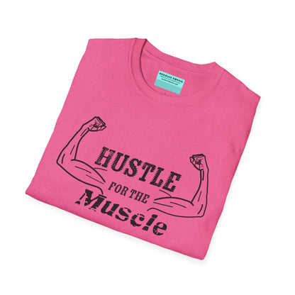 Folded pink unisex short sleeve t-shirt with a bold graphic of strong, flexed feminine arms and the empowering phrase "Hustle for the Muscle"—because strength is stylish and lifting is for everyone.