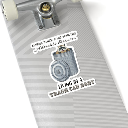 Large sticker on a skateboard with a drawing of a raccoon sitting in a metal trash can, accompanied by the text: 'chronic illness is like being this adorable raccoon living in a trash can body.'
