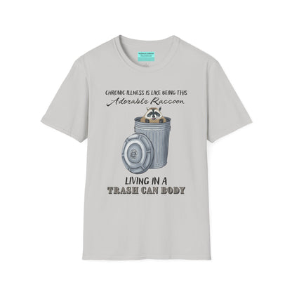 Grey t-shirt featuring an illustration of a raccoon in a metal trash can, with the phrase 'Chronic illness is like being this adorable raccoon living in a trash can body' printed on it.
