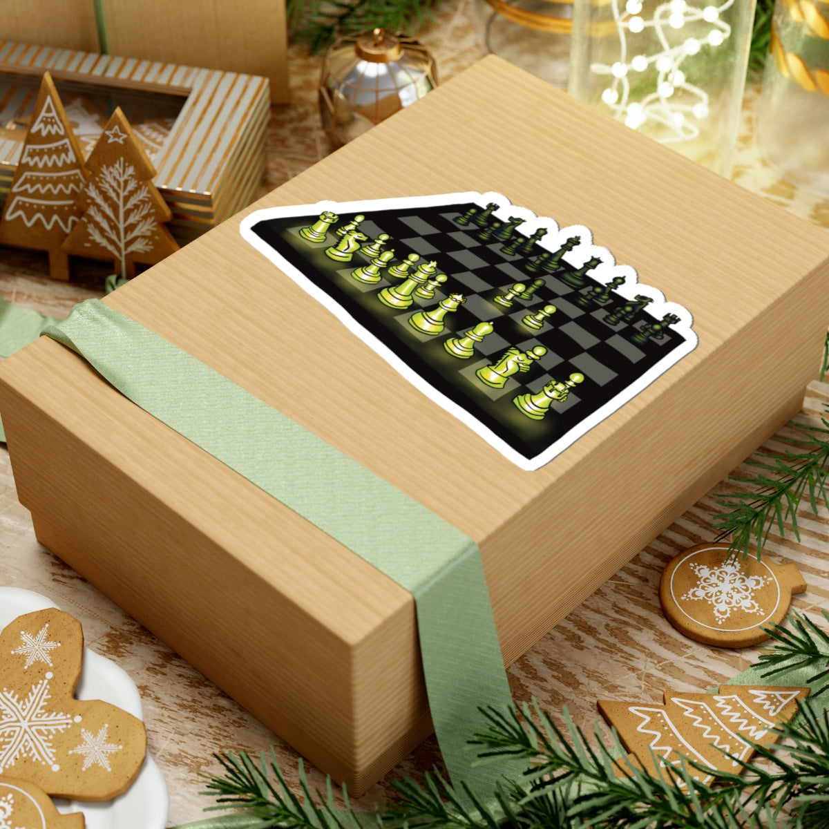 Large sticker on a gift featuring a drawing of a chessboard with pieces illuminated by green light, showing the opening move known as the Queen’s Gambit.