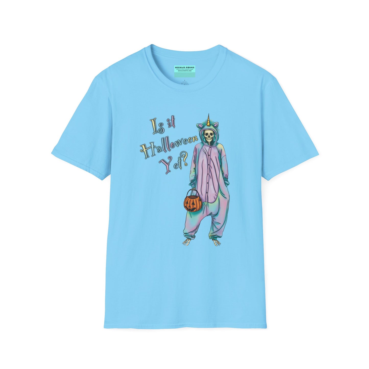 Sky blue t-shirt featuring a drawing of a skeleton in a unicorn costume onesie, with the phrase 'Is it Halloween yet?' printed on it.
