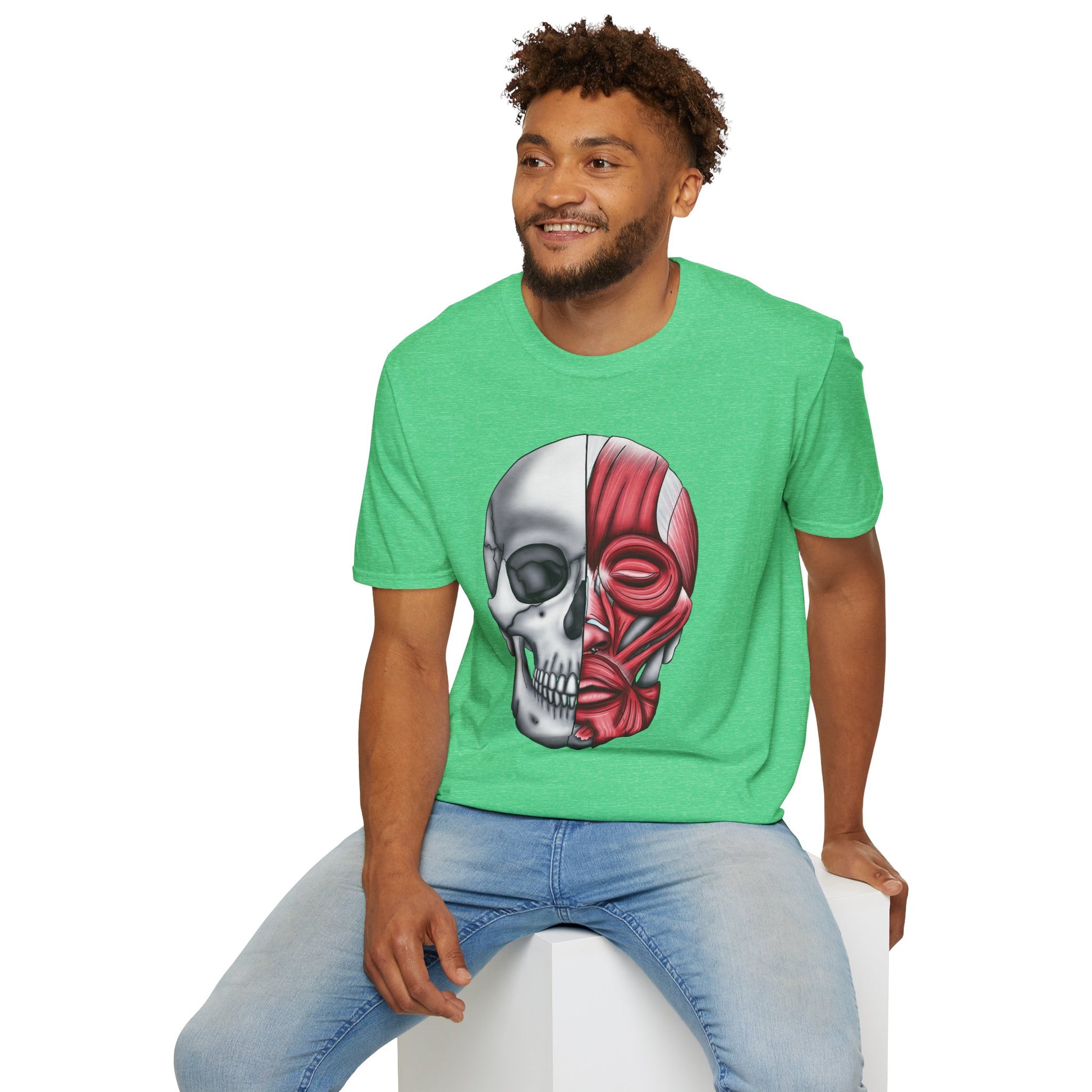 Man wearing a green shirt featuring an anatomically correct skull illustration, with half of the skull covered by facial muscles.