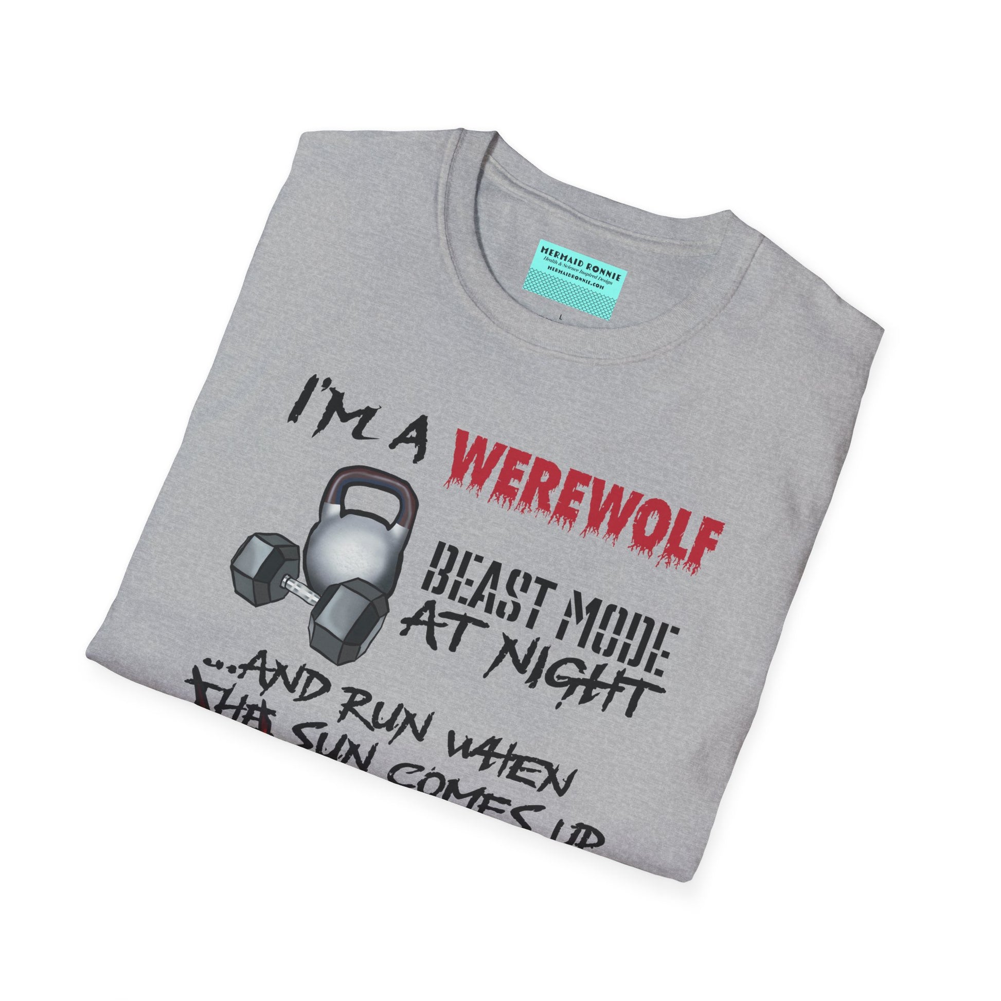 Folded grey t-shirt featuring illustrations of kettlebells, dumbbells, and running shoes, with the phrase 'I'm a werewolf. Beast mode at night, and run when the sun comes up.'