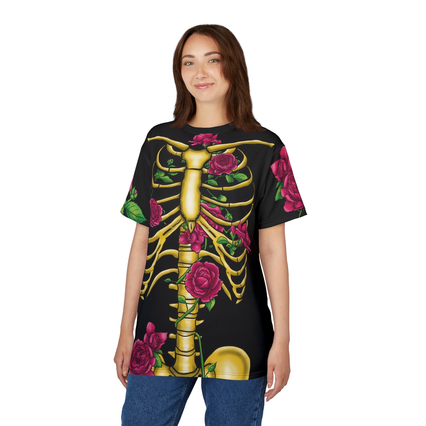 Front view of a woman wearing a unisex black athletic t-shirt featuring a gold anatomical skeleton adorned with blooming pink roses—because strength and beauty aren't mutually exclusive, and your bones deserve to blossom.