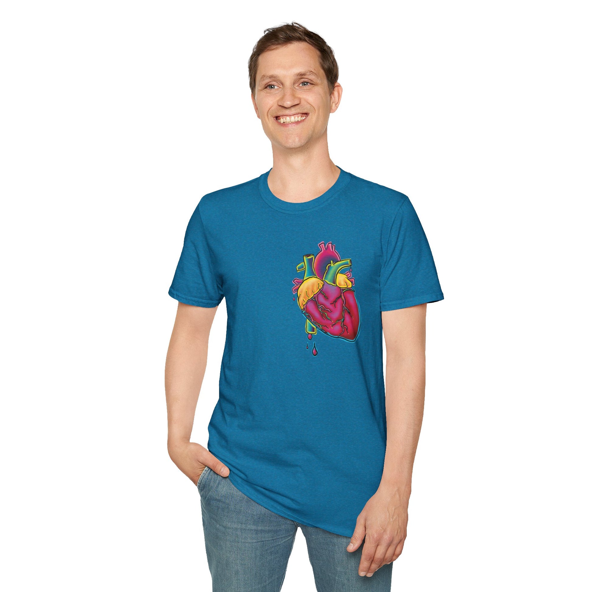 Man wearing a blue unisex short sleeve t-shirt featuring a bold neon anatomical heart front and off-center, complete with dripping blood vessels—because nothing says “wear your heart on your sleeve” like wearing it smack on your chest in highlighter tones.