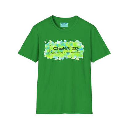 Green short-sleeve unisex t-shirt with playful watercolor-style blue and green splotches, a simple line-drawn beaker, and the witty phrase “CheMystery: because I have no idea what’s going on”—perfect for anyone who’s ever been personally victimized by the periodic table.