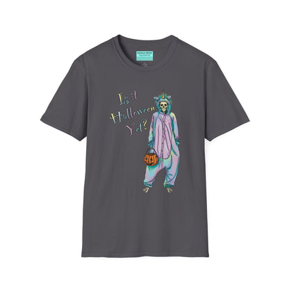 Dark grey t-shirt featuring a drawing of a skeleton in a unicorn costume onesie, with the phrase 'Is it Halloween yet?' printed on it.
