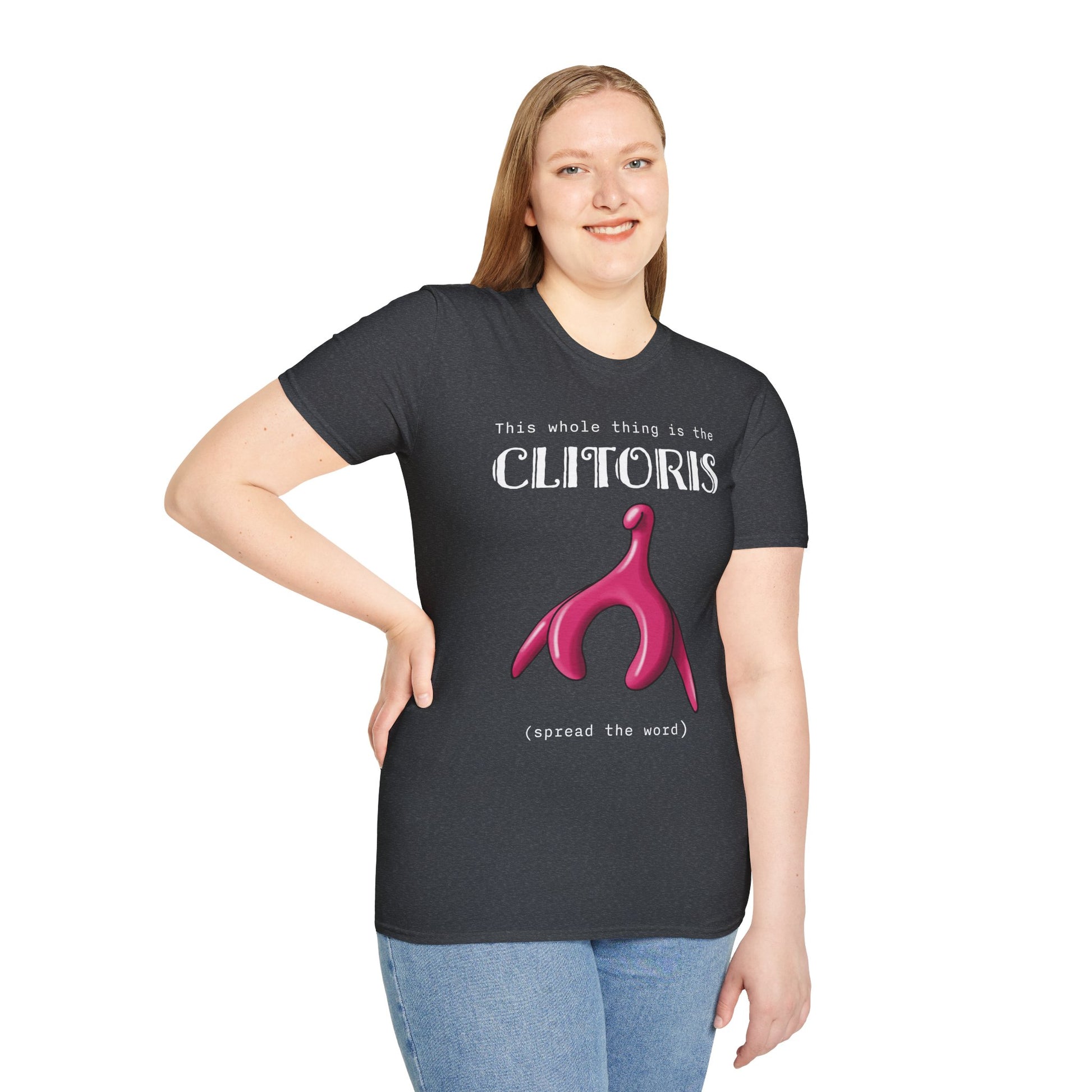 Woman wearing a grey t-shirt with an illustration of the clitoris and white text that reads 'this whole thing is the clitoris. spread the word’.