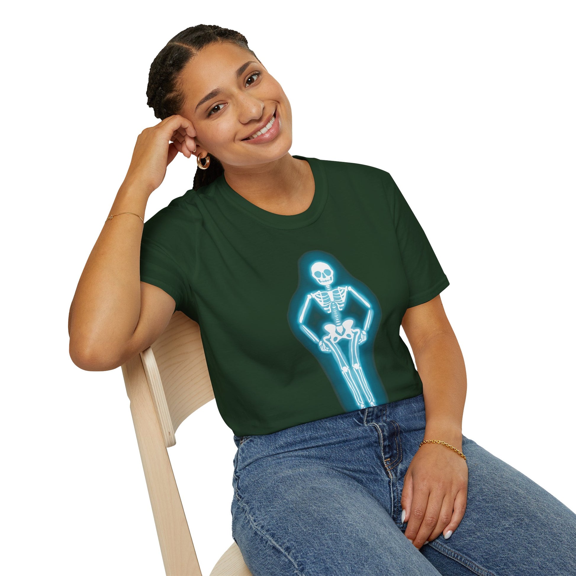 Woman wearing a green t-shirt featuring an illustration of a glowing neon sign in the shape of a skeleton.