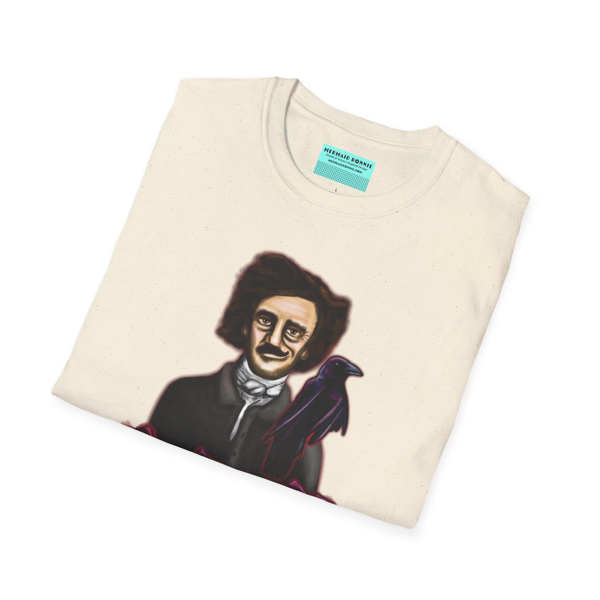 Folded beige t-shirt featuring a drawing of Edgar Allan Poe with a raven perched nearby and red roses surrounding them, along with the quote 'All that we see or seem is but a dream within a dream.'