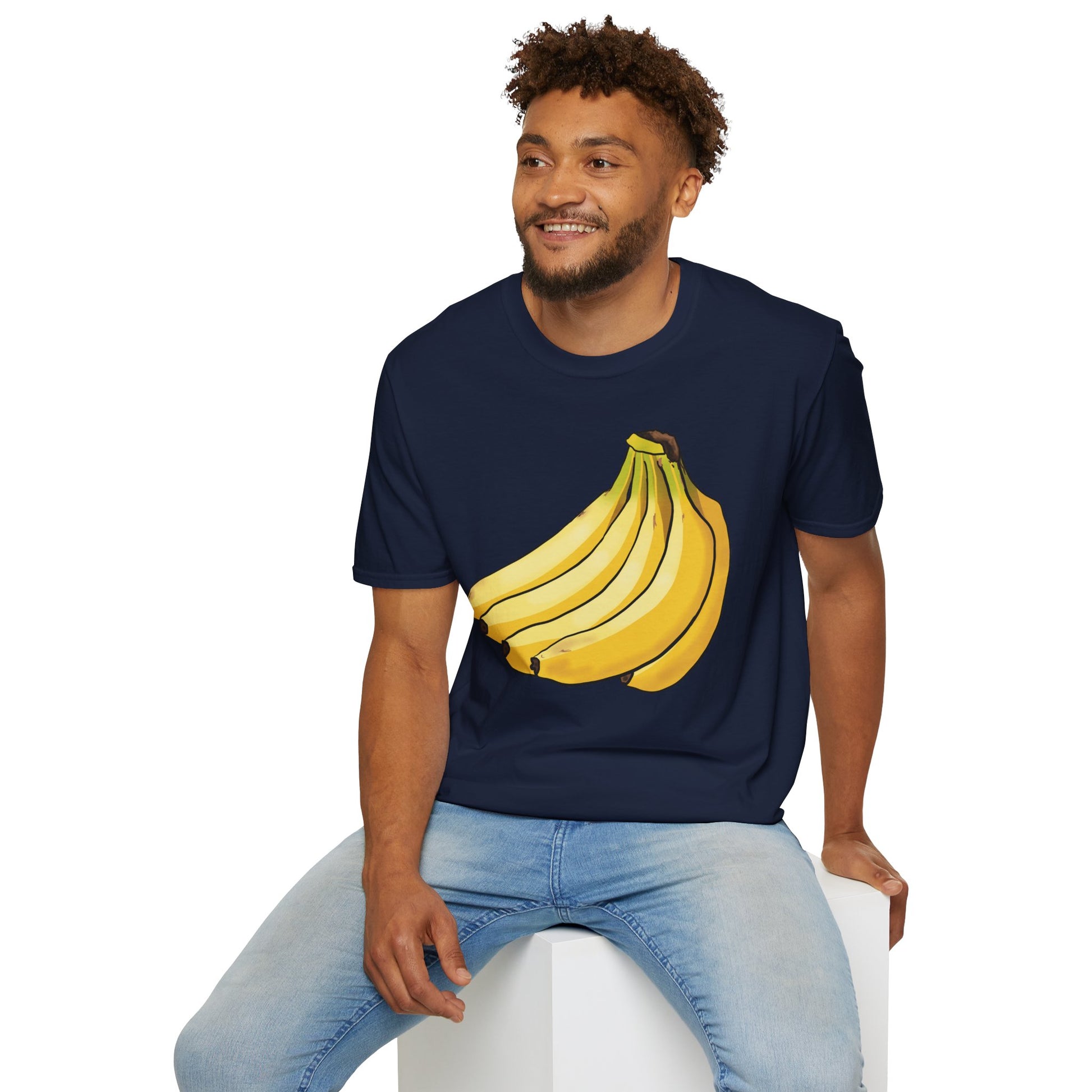 Man wearing a navy t-shirt featuring an illustration of a bunch of bananas.