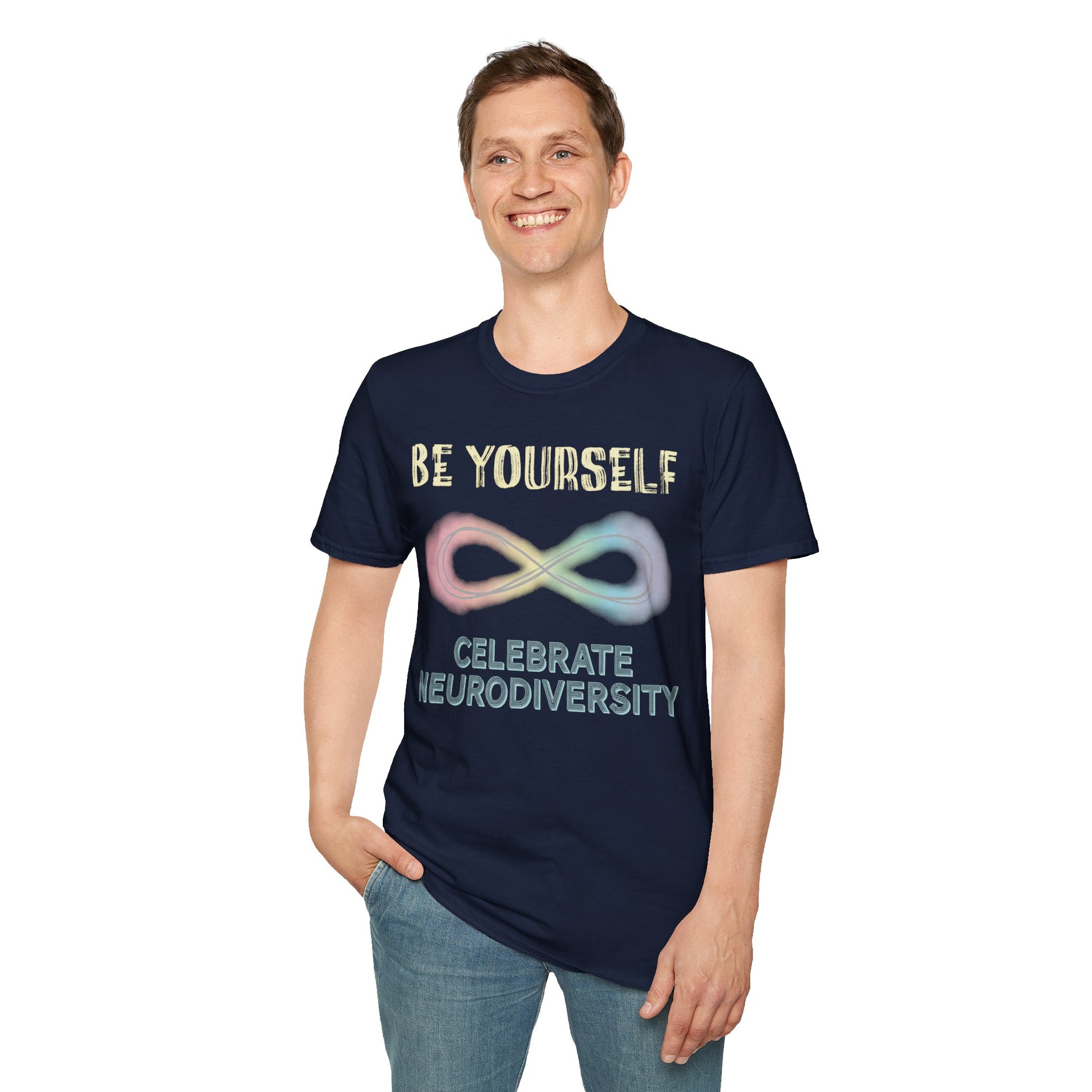 Man wearing a navy t-shirt featuring a pastel-colored rainbow infinity symbol, with the text 'Be yourself, celebrate neurodiversity'.