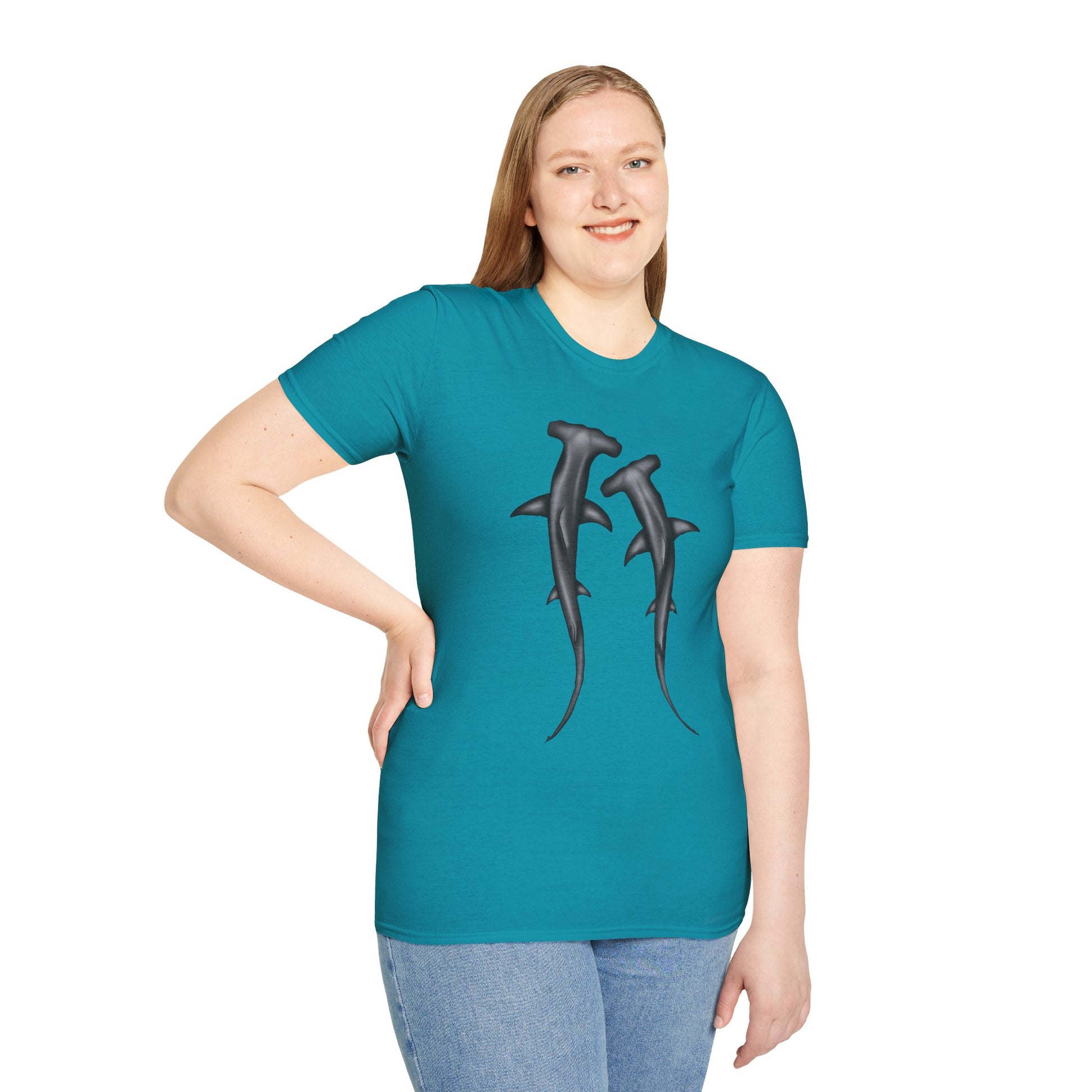 Woman wearing a blue t-shirt featuring an illustration of two hammerhead sharks.