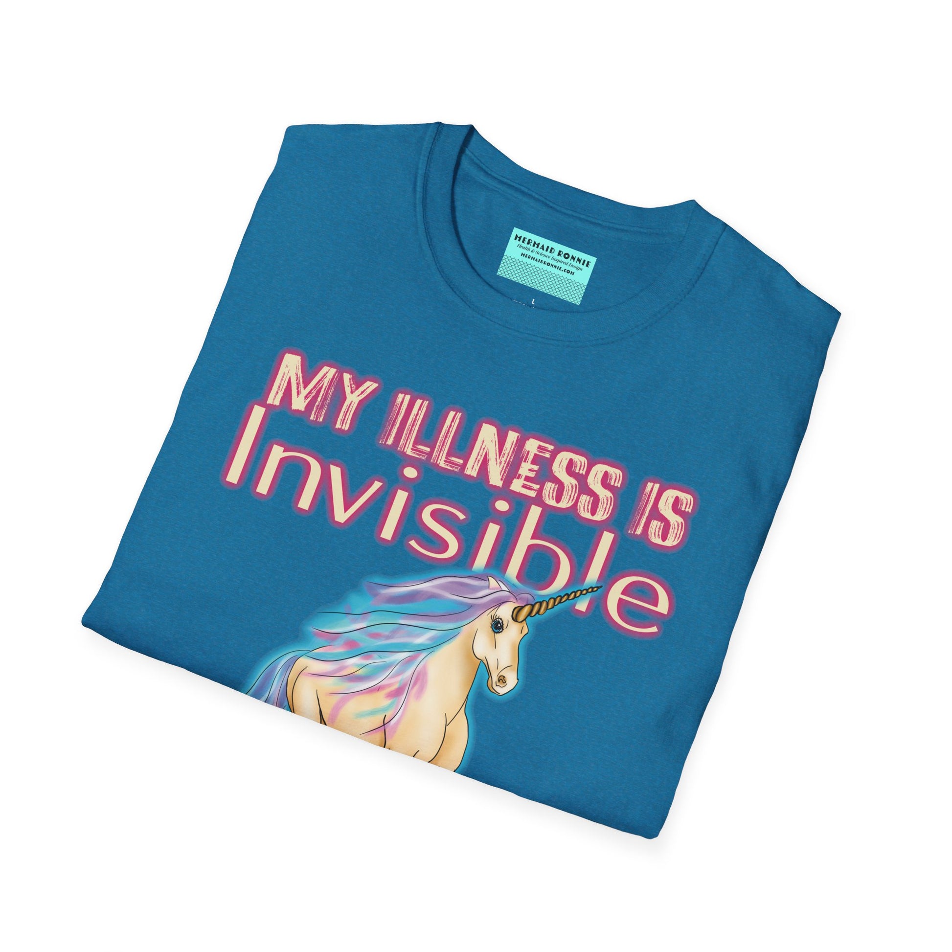 Folded blue shirt featuring a drawing of a unicorn and the phrase 'My illness is invisible not imaginary'.
