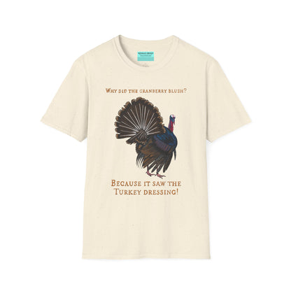 Beige Thanksgiving t-shirt featuring a picture of a turkey and the text 'Why did the cranberry blush? Because it saw the turkey dressing!