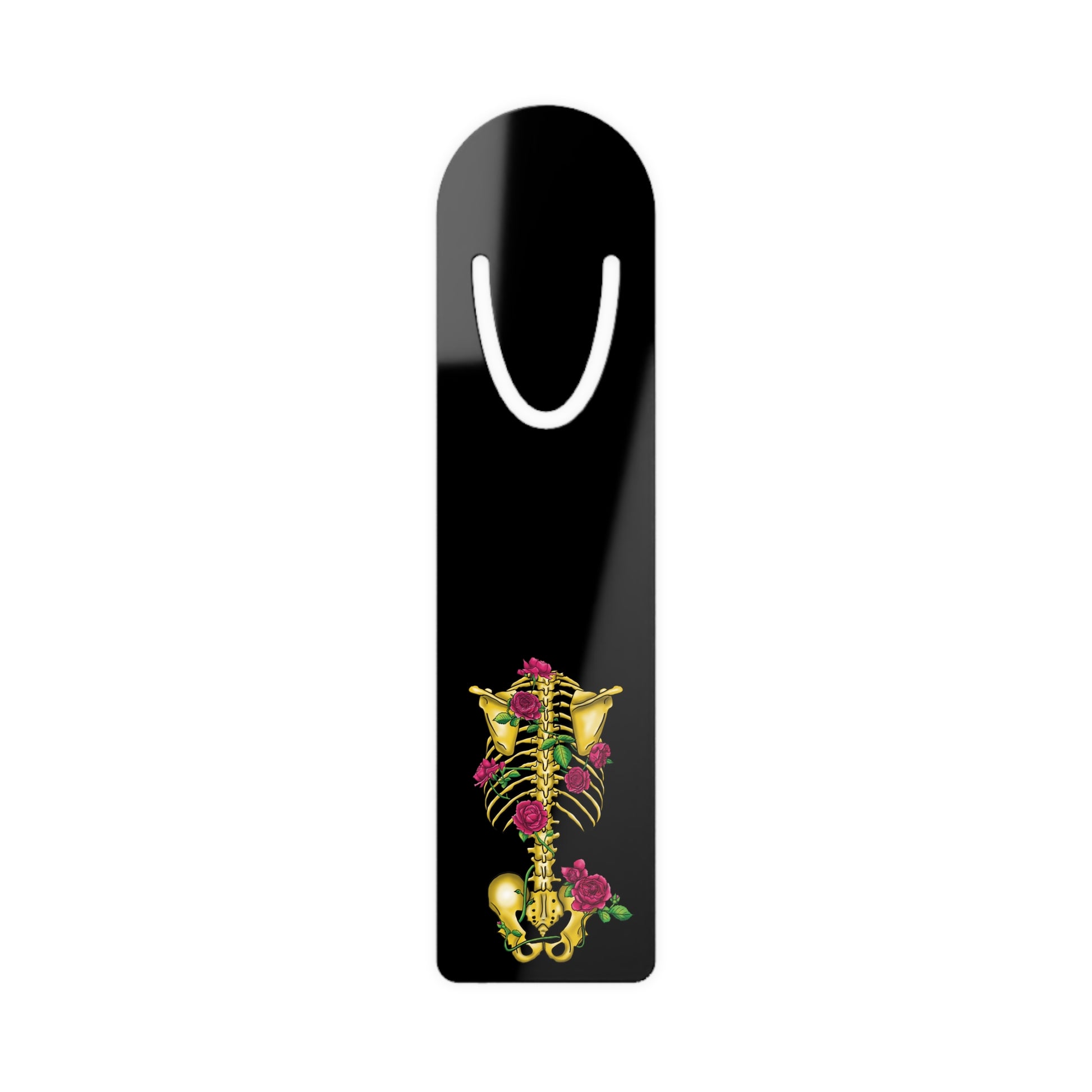 Black aluminum bookmark featuring a gold anatomical skeleton with vibrant pink roses entwined around the bones, creating a striking blend of macabre and botanical elegance.