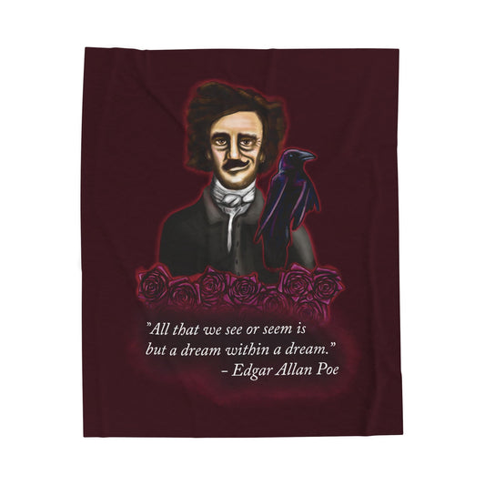 Burgundy velveteen plush blanket featuring a smirking Edgar Allan Poe, a brooding raven, and crimson roses—perfect for cozying up with your favorite haunting thoughts and the poetic quote, "All that we see or seem is but a dream within a dream.