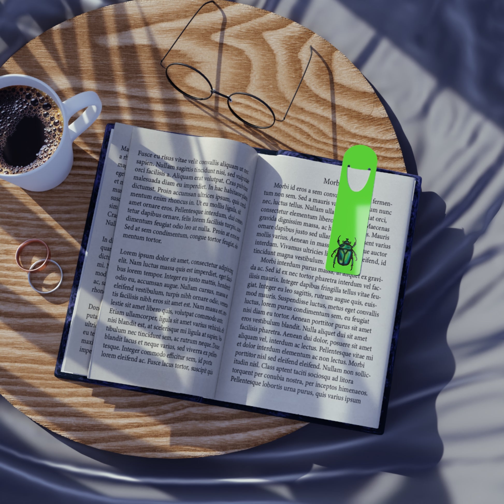 Lime green aluminum bookmark in use featuring a detailed illustration of a June bug (green chafer beetle), its iridescent body gleaming against the vibrant background.