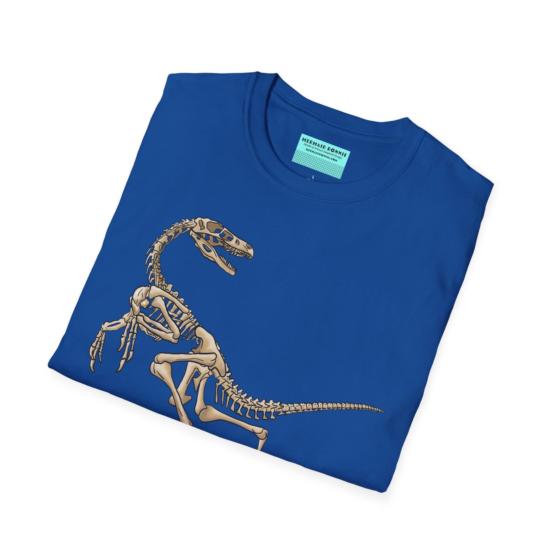 Folded royal blue unisex short sleeve t-shirt with a fierce velociraptor skeleton strutting across the chest—because who says extinct can’t be stylish?