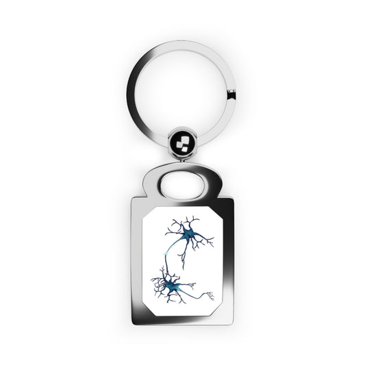 Rectangular silver frame keychain featuring a drawing of two blue neurons forming a synapse, set against a white background.