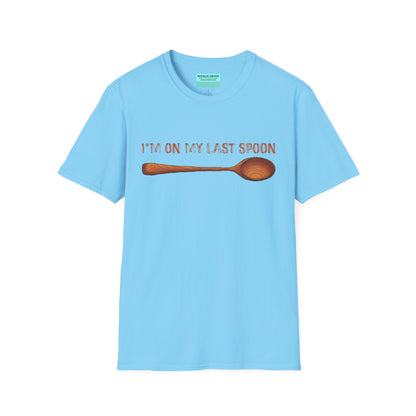 Light blue t-shirt with an illustration of a wooden spoon and the phrase 'I'm on my last spoon' printed on the front.