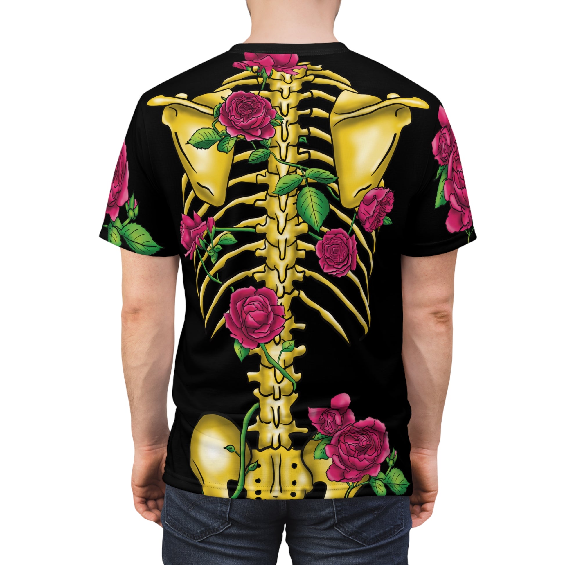 Posterior view of a man wearing a unisex black athletic t-shirt featuring a gold anatomical skeleton adorned with blooming pink roses—because strength and beauty aren't mutually exclusive, and your bones deserve to blossom.