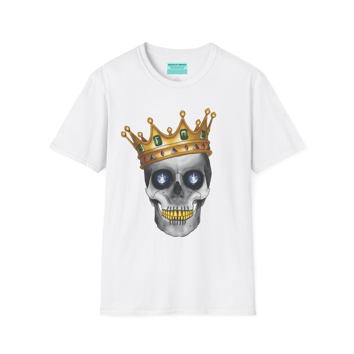 White t-shirt featuring an anatomical skull wearing an ornate crown, with gold teeth, large sapphire gemstones in the eye sockets, and emeralds and rubies decorating the crown.